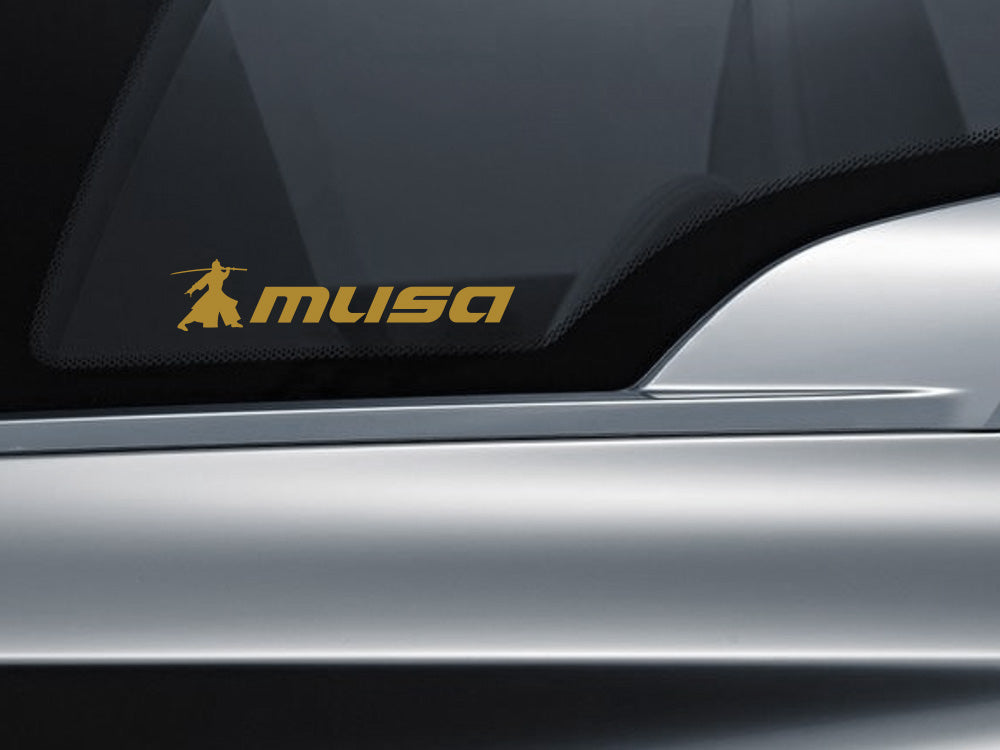 MUSA decal with transparent background displayed on a car window, showcasing sleek design and branding.