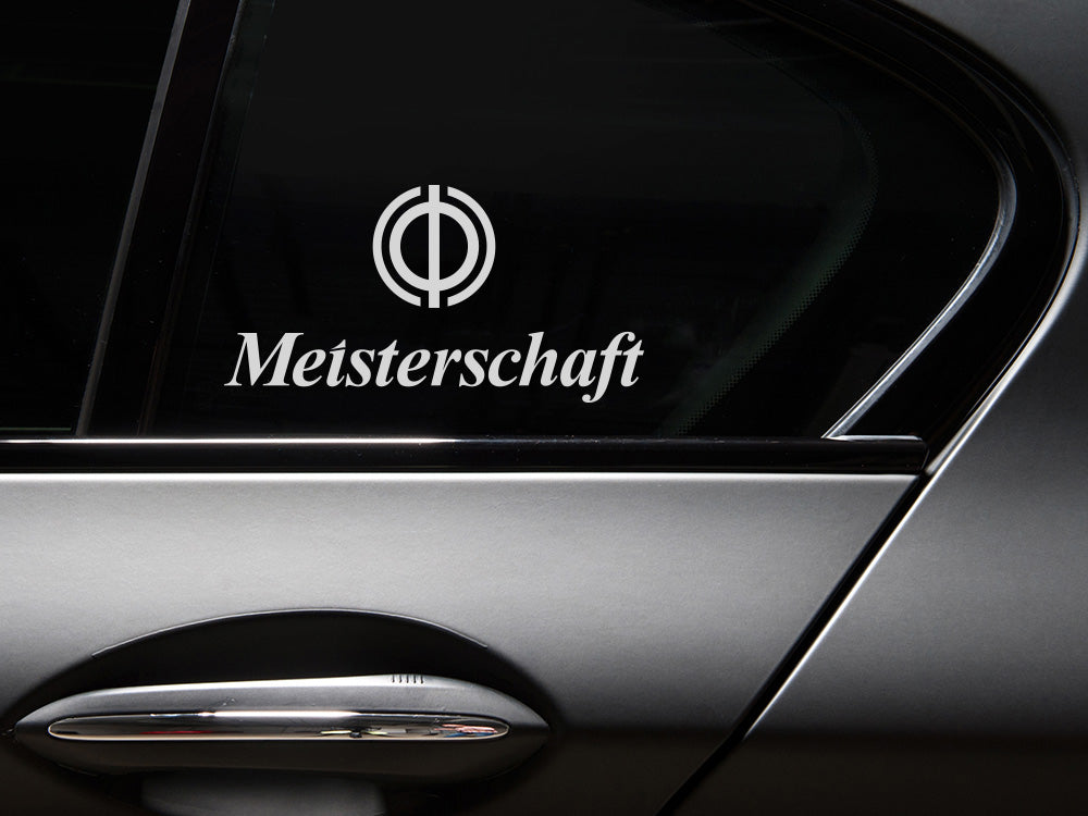 Meisterschaft Icon Decal displayed on a car window, featuring a transparent background and sleek design.