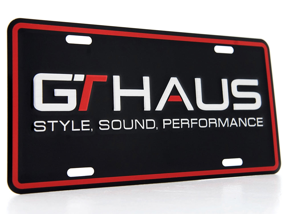 GTHAUS license plate featuring bold logo and tagline "Style, Sound, Performance" on a sleek black background.
