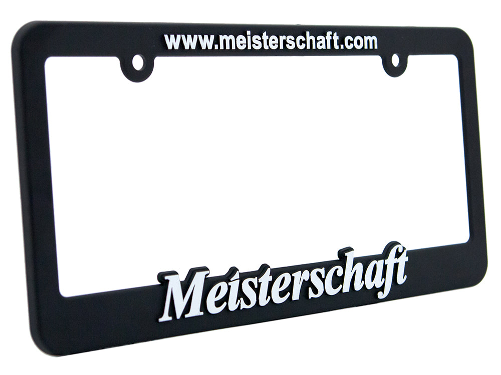 Meisterschaft license frame featuring a sleek black design with white branding for a premium automotive look.