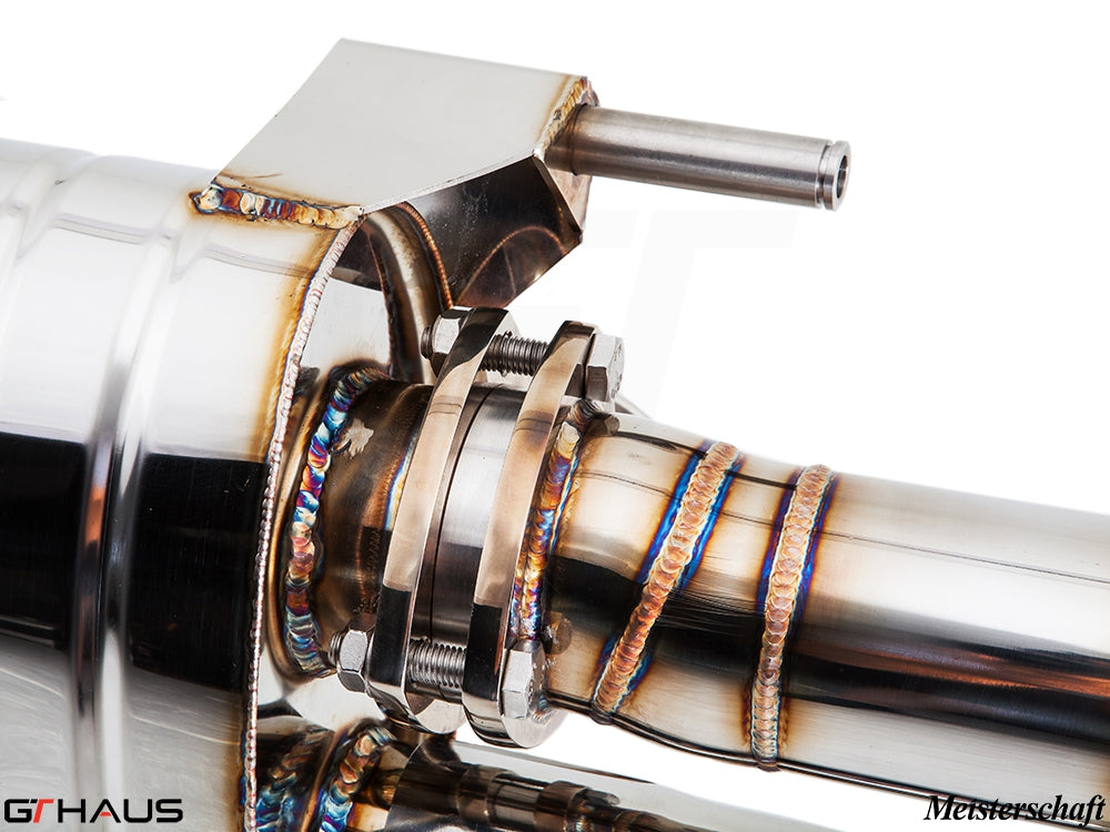 Close-up of a high-performance exhaust system for Audi R8 V10, showcasing precision welding and stainless steel construction.