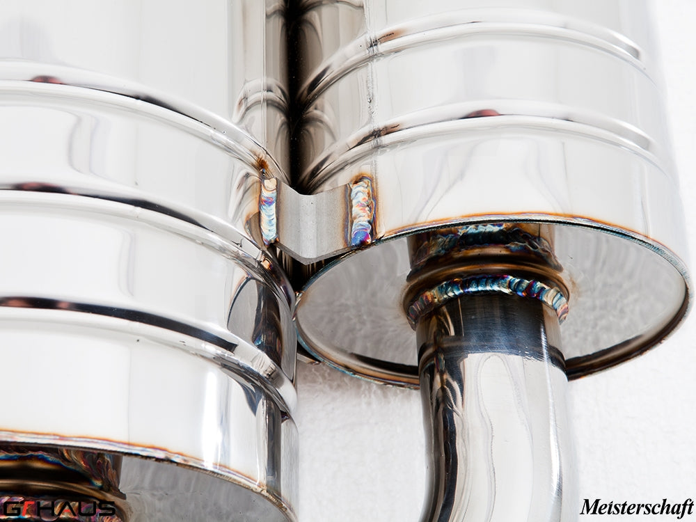 Close-up of a polished stainless steel exhaust system for BMW E60/61 5 Series, showcasing high-quality welds and craftsmanship.