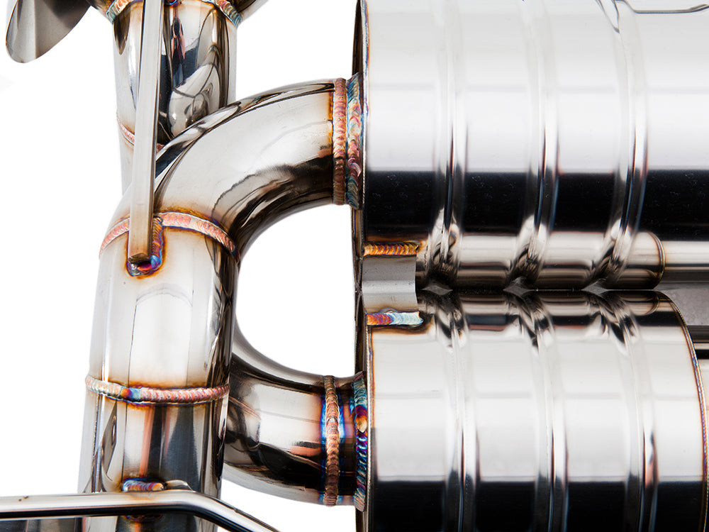 Close-up of a premium stainless steel exhaust system for BMW E90/92/93 M3, showcasing precision welding and design.