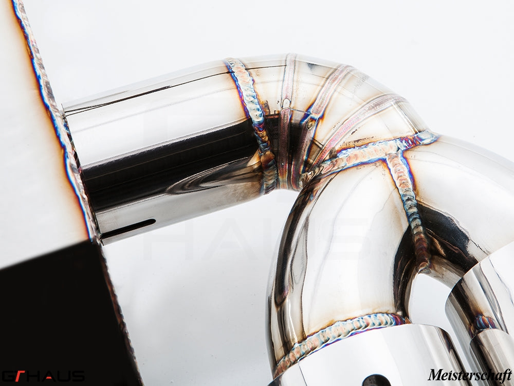 Close-up of a hand-welded stainless steel exhaust pipe for BMW F30/F31/F34/F36 335i/340i, showcasing precision craftsmanship.