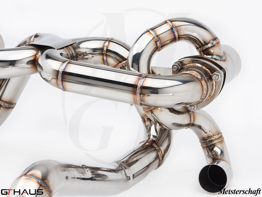 High-performance stainless steel exhaust system for Ferrari F430 Scuderia, showcasing precision welding and design.