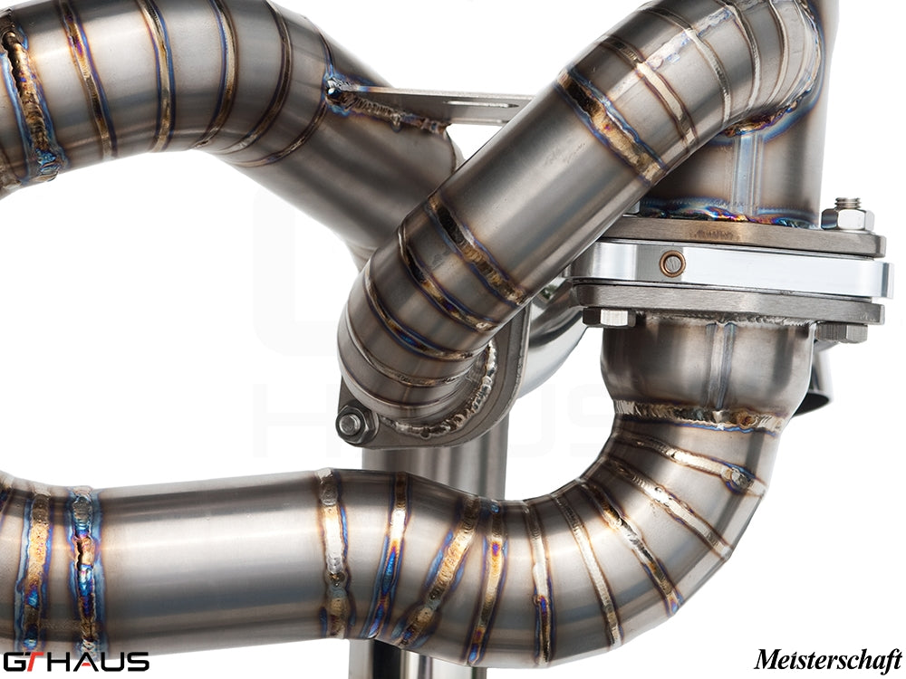 High-performance exhaust system for Ferrari F430 Scuderia, showcasing precision welding and stainless steel construction.