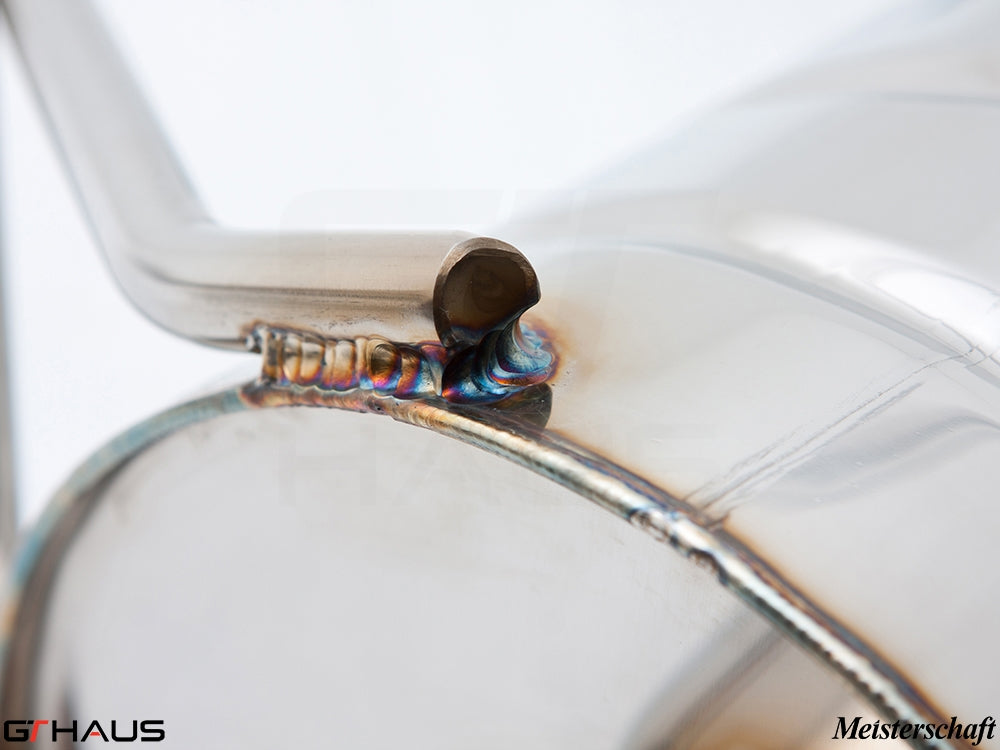 Close-up of a high-quality stainless steel exhaust system for the Mercedes-Benz W164 ML63 AMG, showcasing precise welding and craftsmanship.