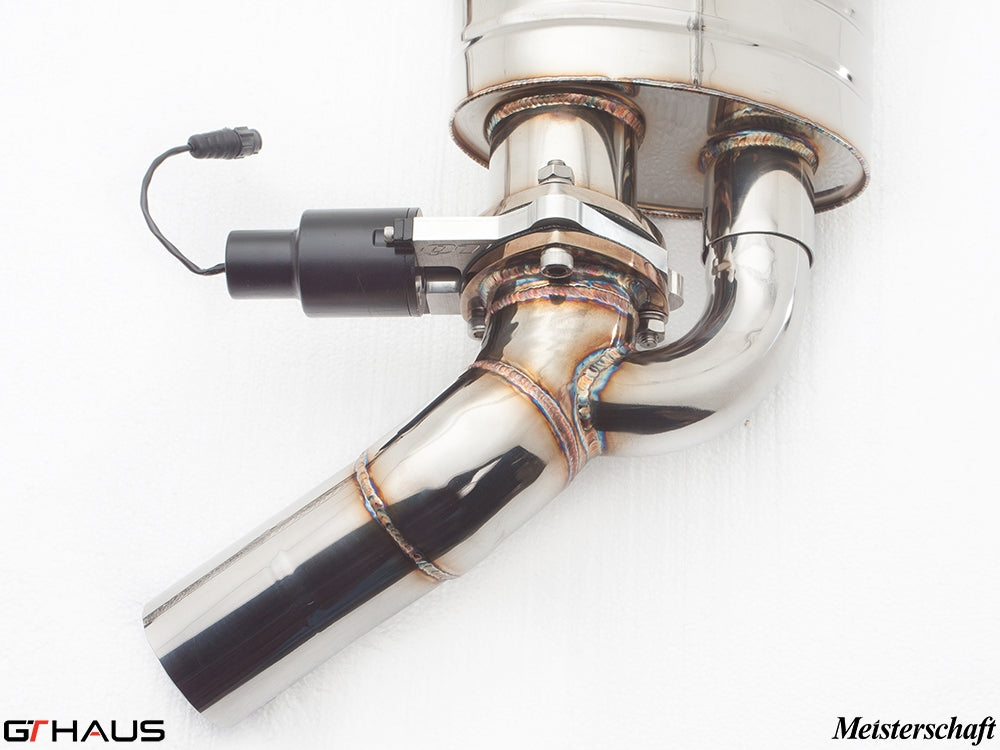 Close-up of a polished stainless steel exhaust system with electronic valve control for Mercedes-Benz W221 S63 AMG.