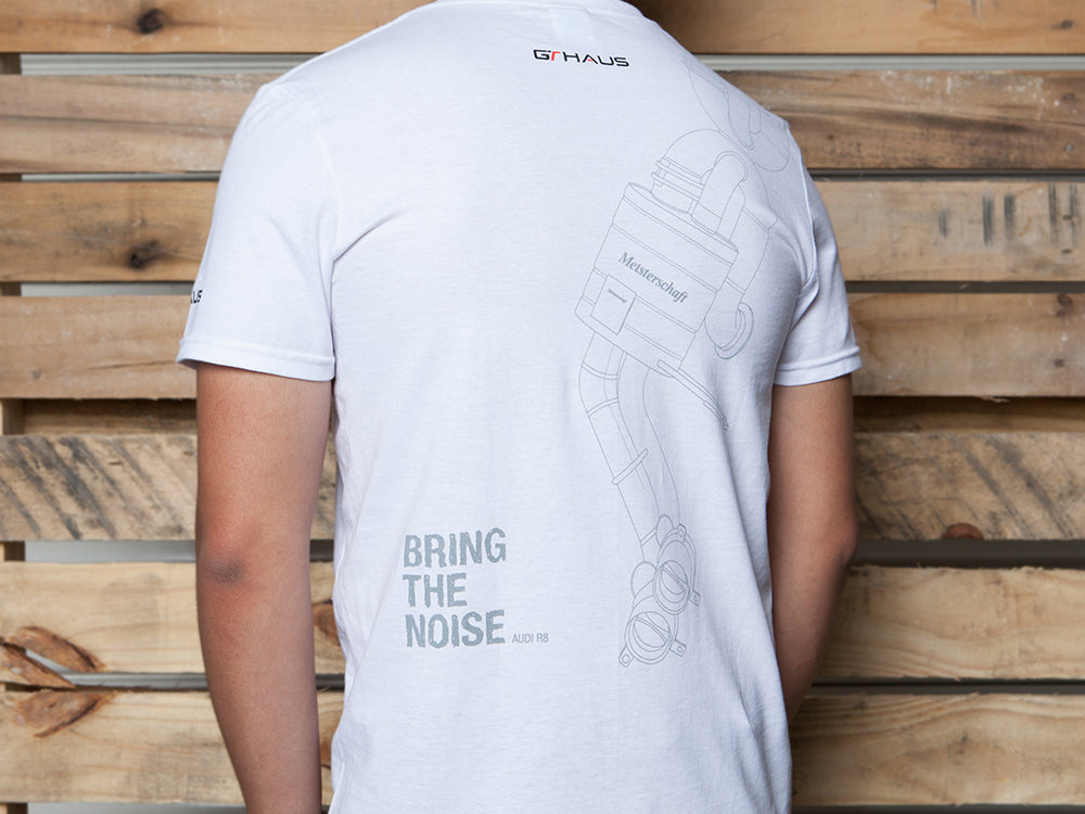 White MEISTERSCHAFT T-shirt featuring an Audi R8 exhaust design on the back with the text "BRING THE NOISE.