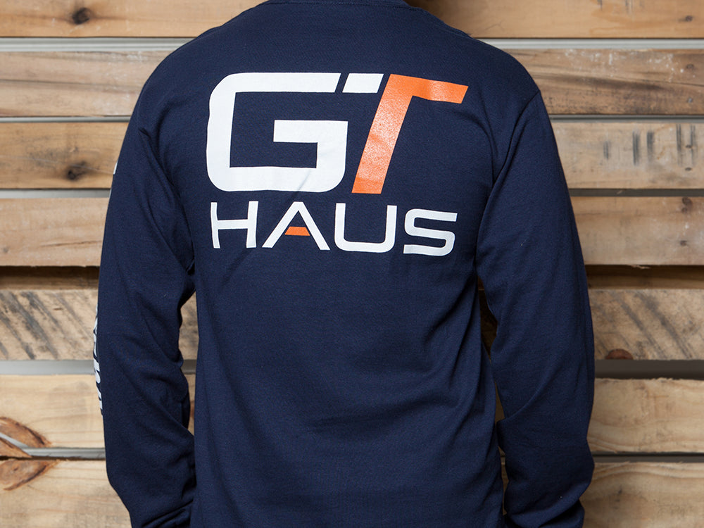 Navy GTHAUS long-sleeve T-shirt featuring a bold logo on the back, perfect for automotive enthusiasts.