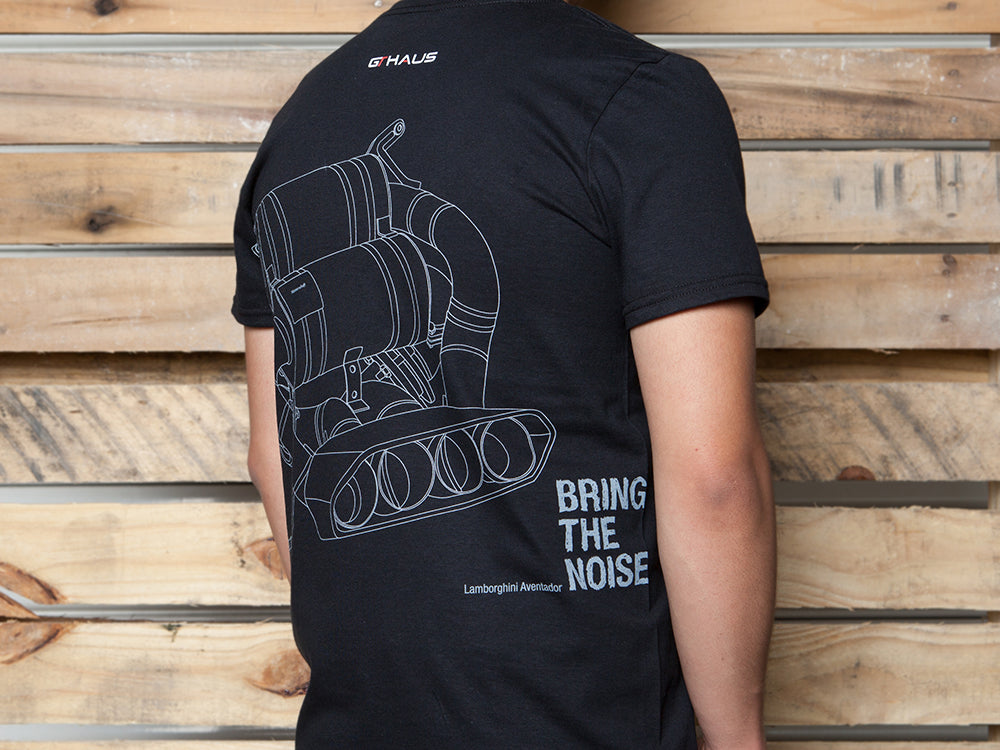 Black MEISTERSCHAFT T-shirt featuring a Lamborghini Aventador exhaust design and the text "BRING THE NOISE" on the back.