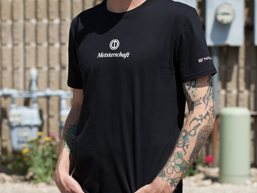Black MEISTERSCHAFT T-shirt featuring the logo, designed for Audi R8 enthusiasts, showcasing a stylish automotive theme.