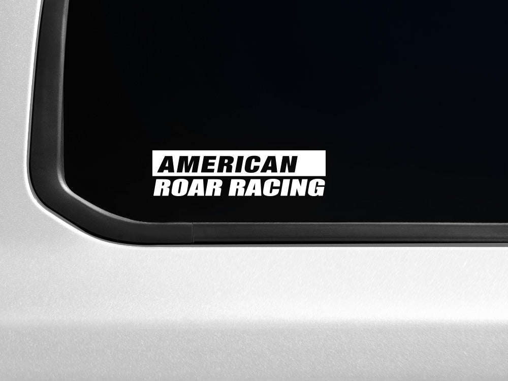 American Roar Racing decal on a vehicle window, featuring bold white text on a transparent background.