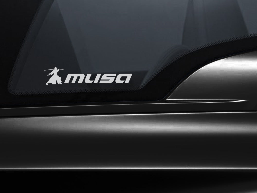 MUSA decal with a transparent background displayed on a car window, showcasing the brand logo.
