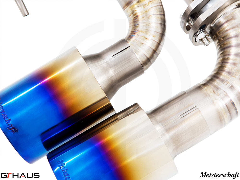 Premium exhaust tips for Alfa Romeo Giulia Quadrifoglio featuring a polished finish and vibrant blue tint.