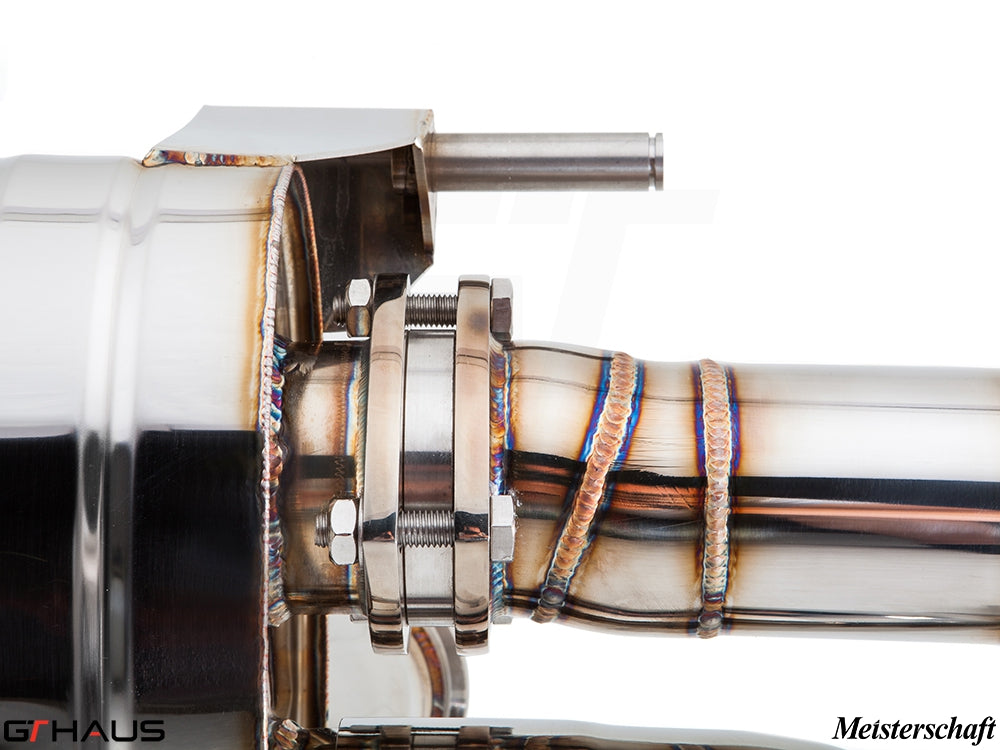 Close-up of a Meisterschaft exhaust system for Audi R8 Coupe/Roadster 4.2L V8, showcasing precision welding and stainless steel construction.