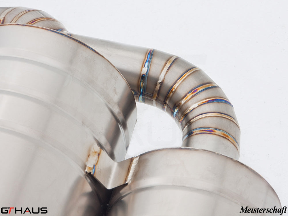 Close-up of a high-performance stainless steel exhaust system for the BMW E39 M5, showcasing precision welding and craftsmanship.