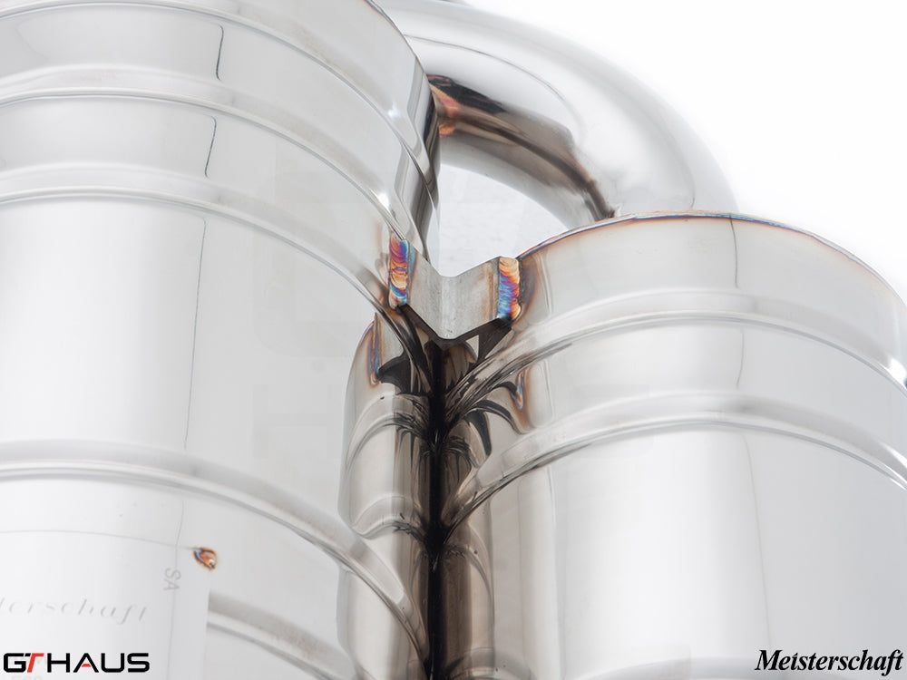 Close-up of a Meisterschaft exhaust system for BMW E60 M5, showcasing high-quality stainless steel craftsmanship.