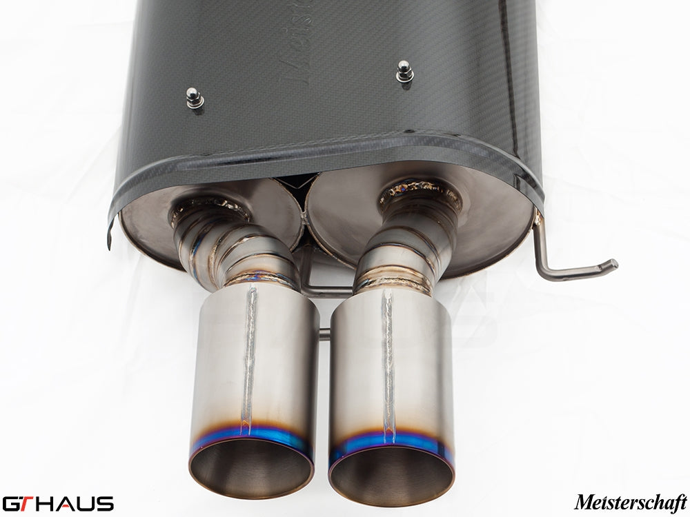 Premium Meisterschaft exhaust system for BMW E60 M5 Sedan V10, showcasing dual polished tips and carbon fiber finish.