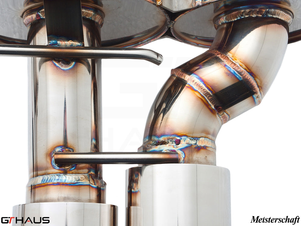 Close-up of a high-performance exhaust system for BMW E63/64 M6, showcasing precision welding and stainless steel craftsmanship.