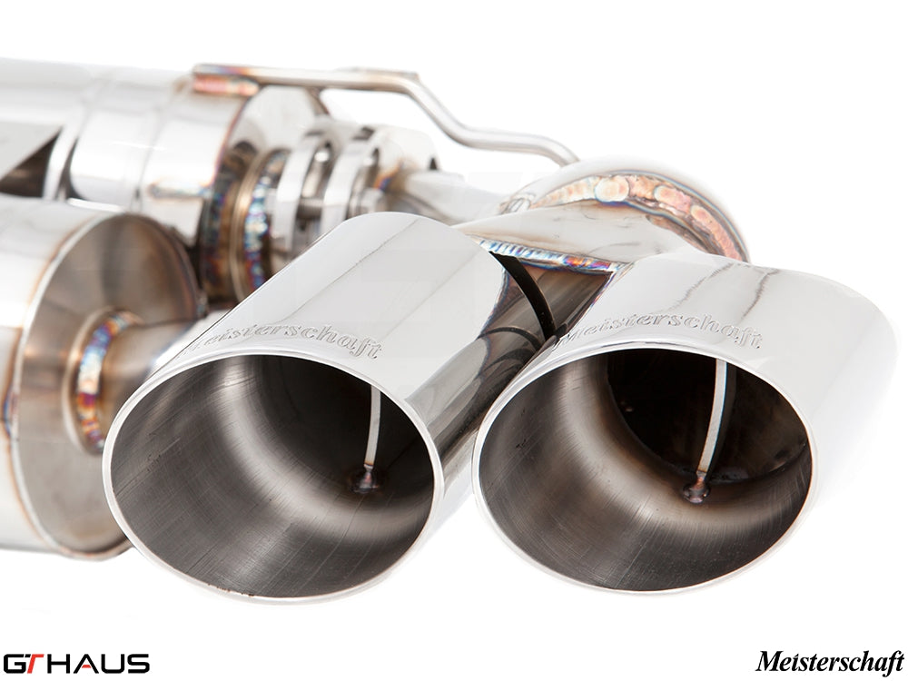 Premium exhaust tips for BMW E70 X5 5.0i, showcasing polished stainless steel finish and Meisterschaft branding.