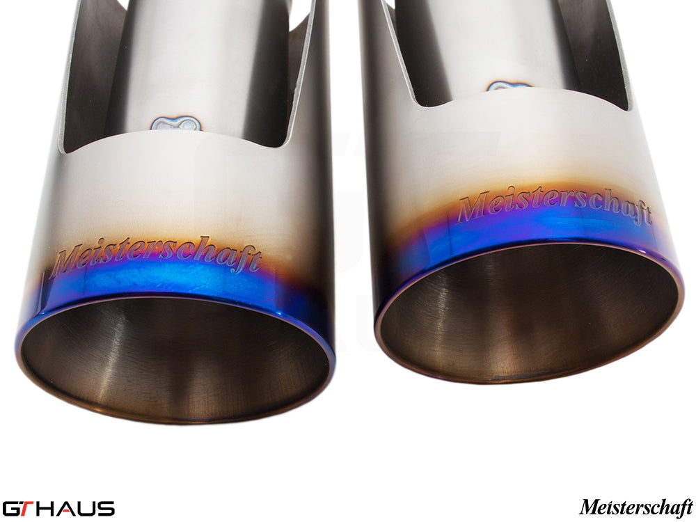 Premium exhaust tips for BMW E71 X6M, featuring Meisterschaft branding and a polished finish with blue tint.