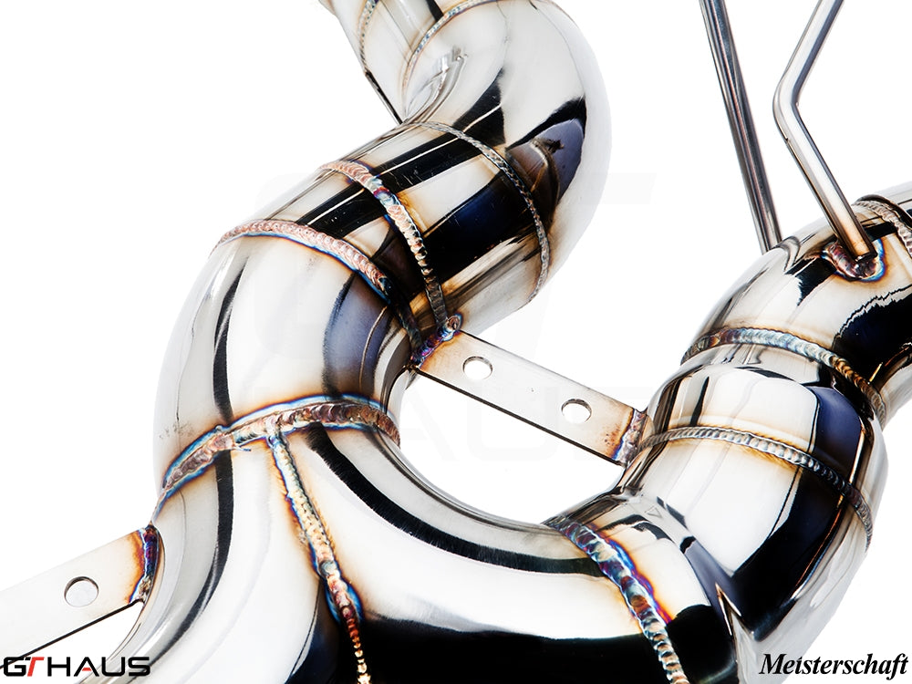 Premium stainless steel exhaust system for BMW F32/F33 4 Series, showcasing intricate welds and smooth curves.