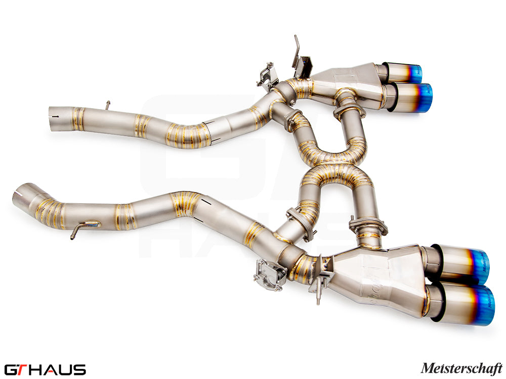 Premium performance exhaust system for BMW F87 M2, M2 Competition, and M2 CS, featuring stainless steel construction and blue-tipped tips.