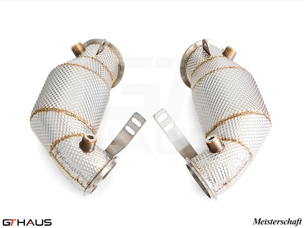 BMW F96 X6M 2020+ down pipes with 400 CEL sport cats, featuring 90mm piping and heat-resistant mesh wrapping.