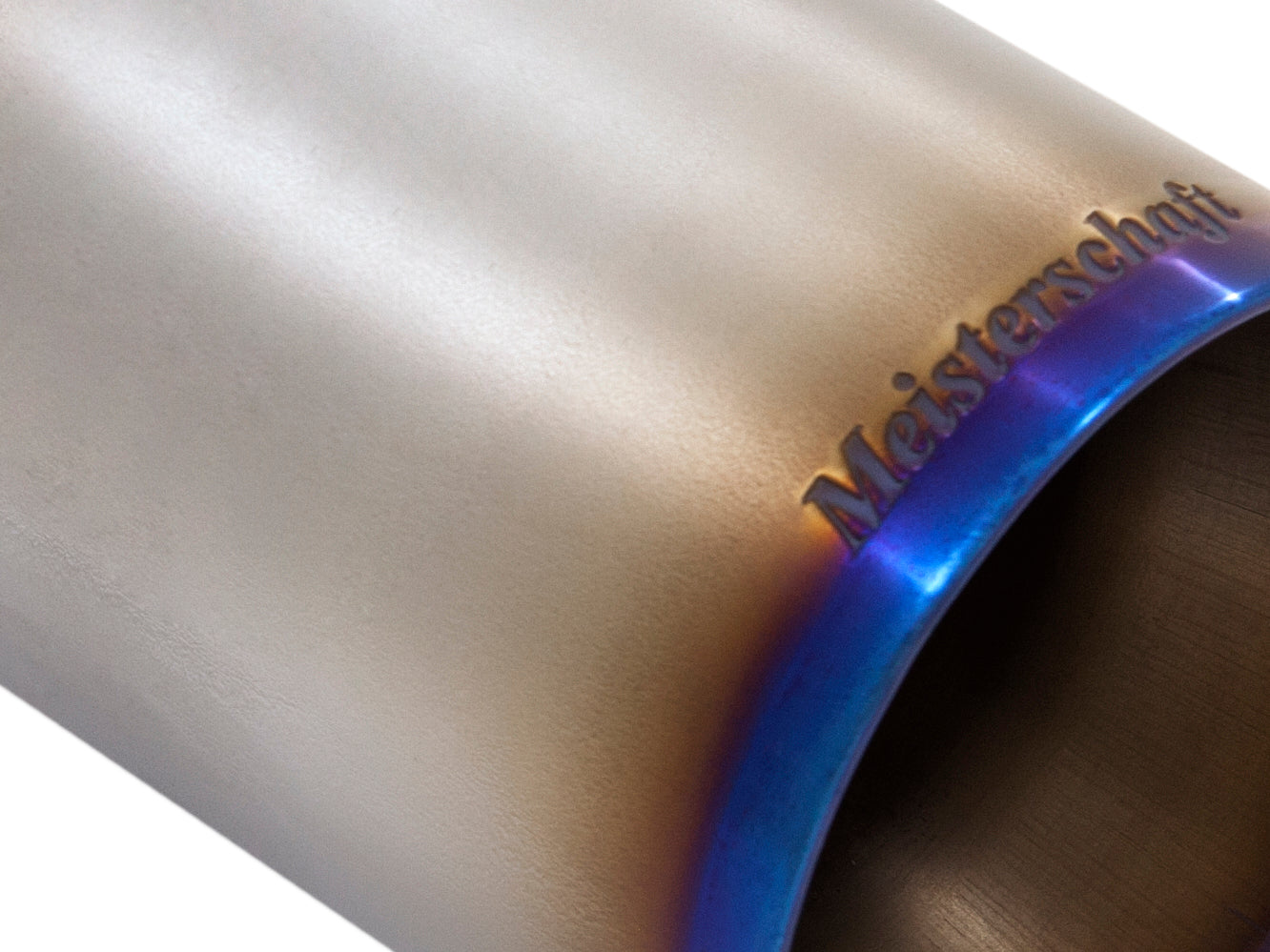 Titanium exhaust tip for Ferrari F430 Scuderia, featuring Meisterschaft branding and a polished finish.