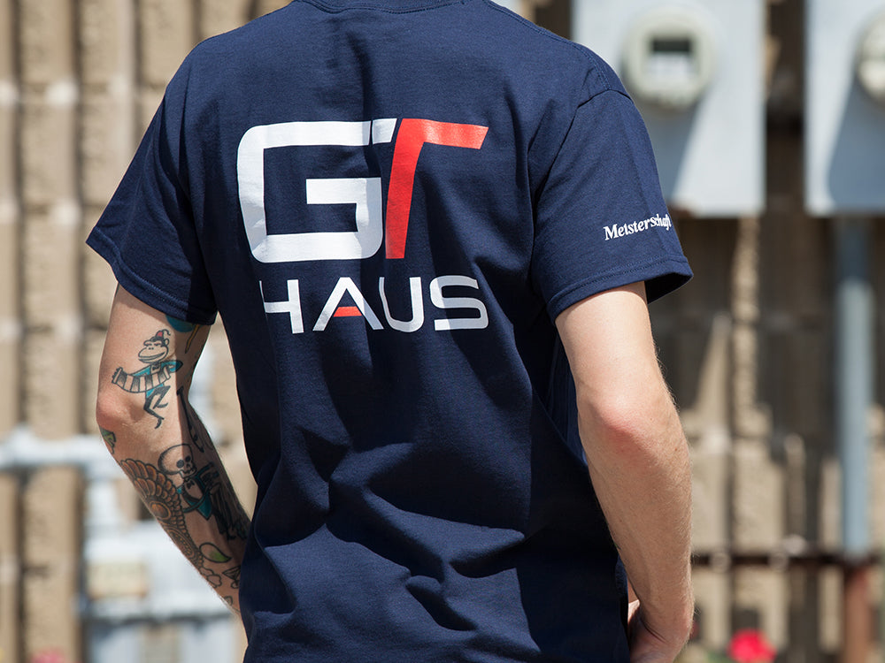 Navy GTHAUS T-shirt featuring a bold logo on the back, ideal for automotive enthusiasts and fans of performance brands.