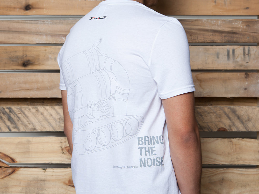 White MEISTERSCHAFT T-shirt featuring a Lamborghini Aventador exhaust graphic and "BRING THE NOISE" text on the back.